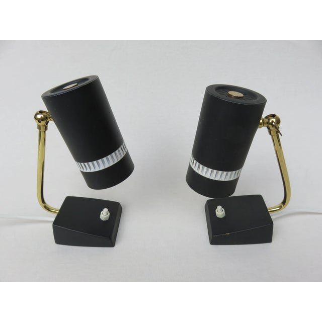 - The lamp arms are made of brass - The base and shades are made of matte black lacquered metal - The borders are in white...