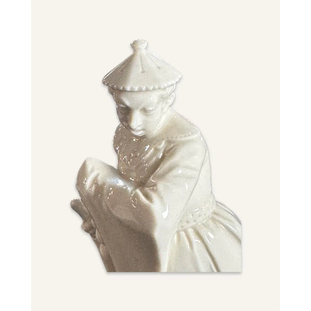 This porcelain figurine was manufactured by Nymphenburg in Munich, Germany around 1948. The factory was established 1747....