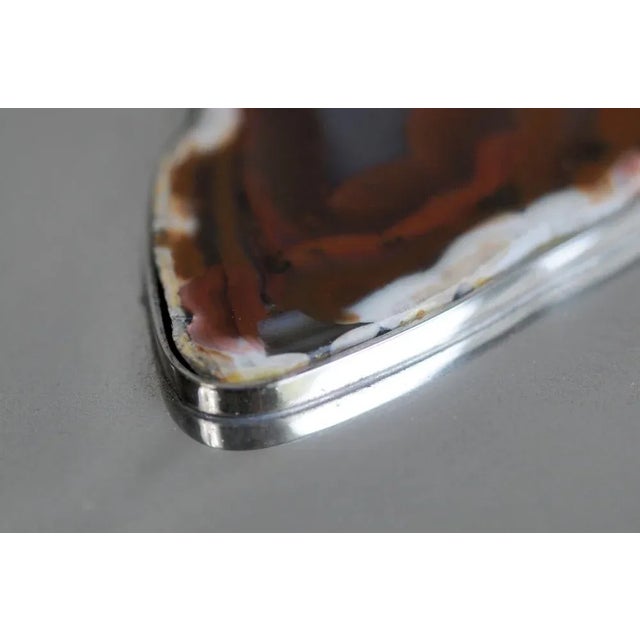 Maria Pergay (1930), Large flat silver-plated metal box, France 1970. A red-veined agate stone is set on the lid, and the...