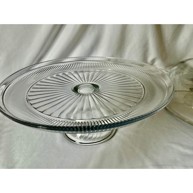 Glass pedestal cake stand wiith pressed glass design and dome.. Can also be used as large compote for other deserts, for...
