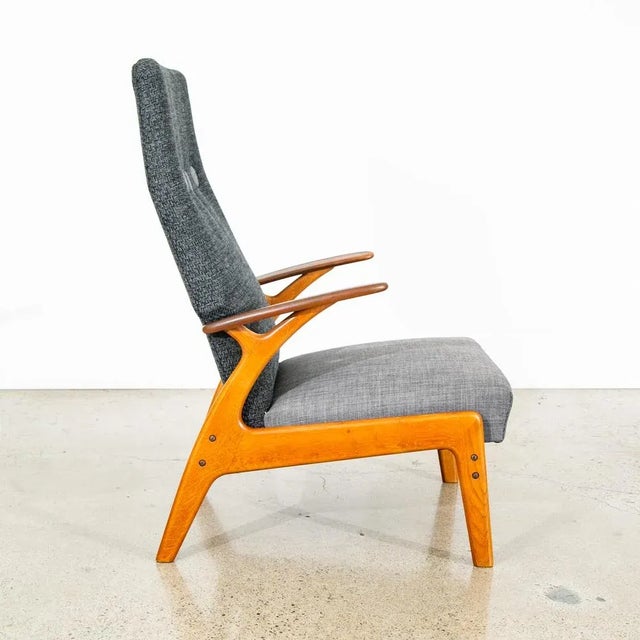 Rarely seen Christian Sorensen reclining lounge chair with solid teak arms on a solid white oak frame. The piece reclines...