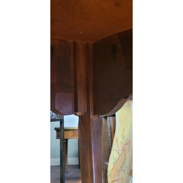 Fine antique French side table. Features inlaid deco style top, intricate carved frieze on long slender French legs ending...