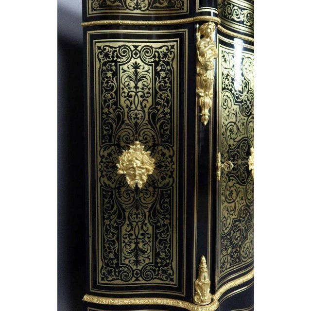 "19th Century Boulle Marquetry Sideboard" Boulle marquetry sideboard decorated with gilded bronze. This piece of furniture...