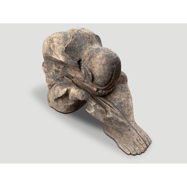 A beautiful praying Buddha hand carved from a single piece of wood. Circa 1930 This antique praying Buddha was hand carved...