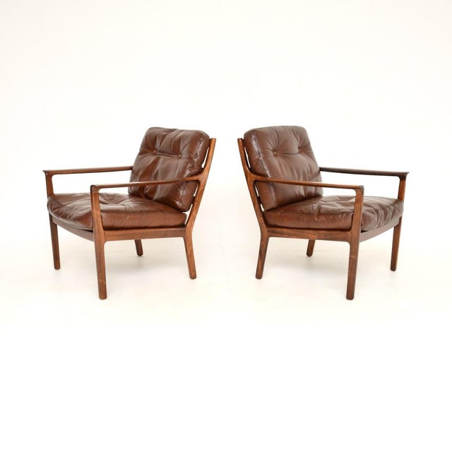A beautifully designed pair of vintage Scandinavian leather armchairs by Frederik Kayser. They were made in Norway by...