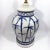 This Chinoiserie Ginger Jar style table lamp is hand-painted with bamboo shoots in shades of blue. The body is a neutral...