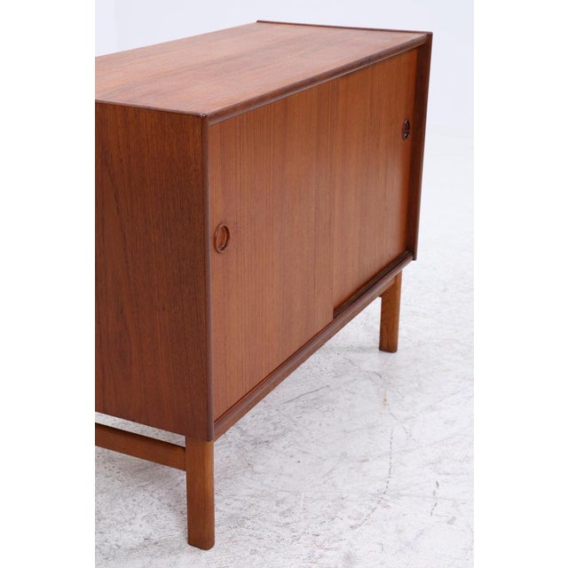 Beautiful Mid-Century Teak Chest of Drawers from the 1960s • Vintage teak chest of drawers • Two sliding doors with...