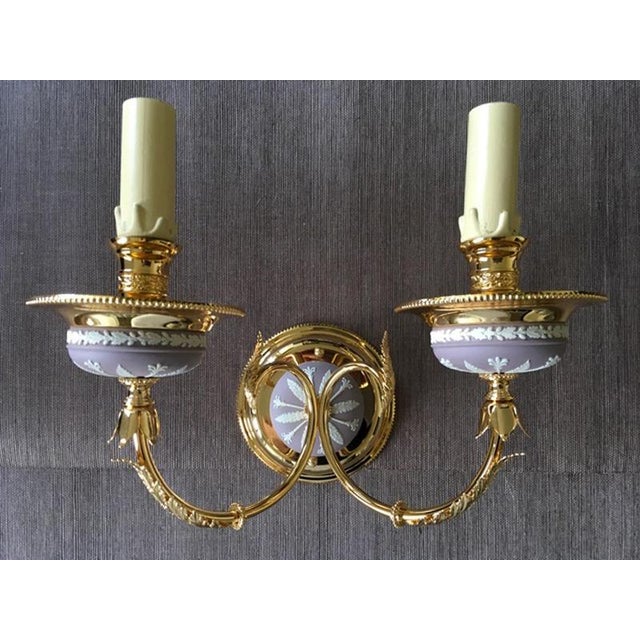 This elegant and glamourous two lights wall light in pink lilac color, it is part of the latest pieces manufactured by a...