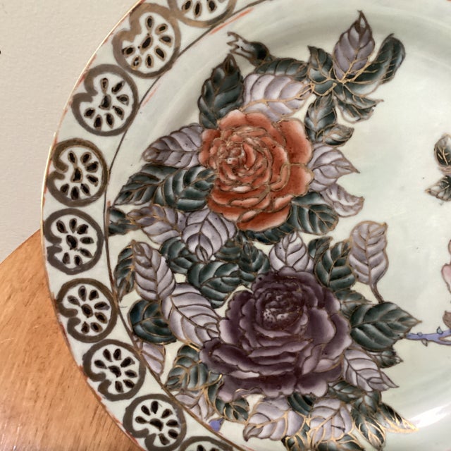 The product is a rare and valuable vintage Chinese porcelain Qing period Famille Rose plate with a red seal mark. This...