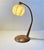 Exquisite and very versatile Italian desk or table lamp. It features a sunburst base and pin-striped rod in walnut....