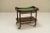 Trolley in solid wood finished with mahogany veneer.The practical function of the trolley, also called a serving trolley,...