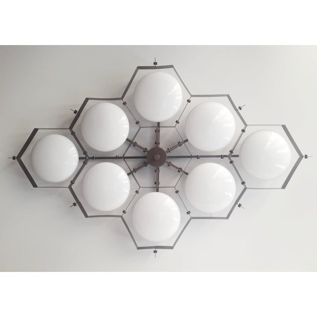 Italian midcentury flush mount with eight glossy white Murano glass shades mounted on solid brass frame in bronze finish /...
