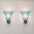 Elegant pair of Italian wall lights from the 1950s, attributed to Barovier & Toso and crafted with blue Murano glass...