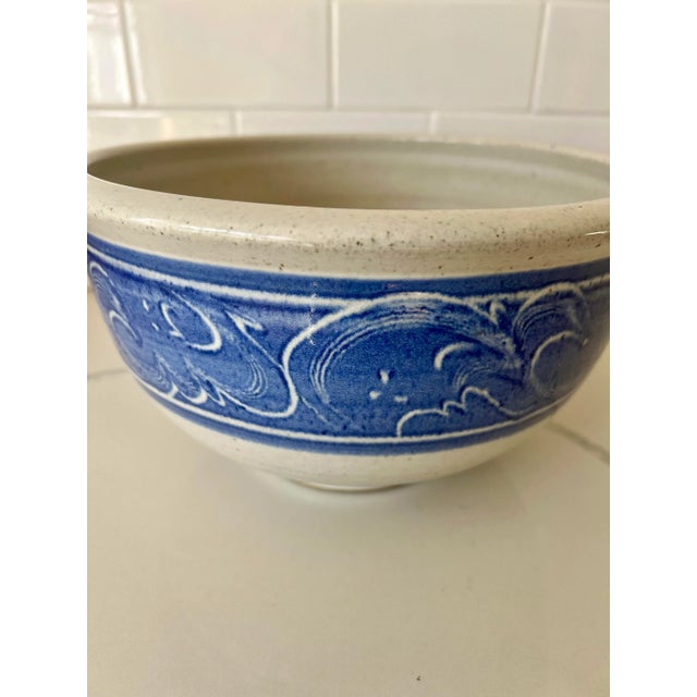 This beautiful blue and white pottery bowl is perfect for serving or to use as a centerpiece bowl with flowers or fruit....