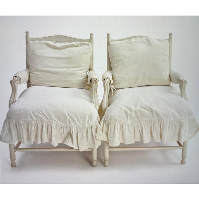 This armchair is a so-called "Gripsholm" model. Cream-white painted wood with loose seat and back cushions. The cover is...