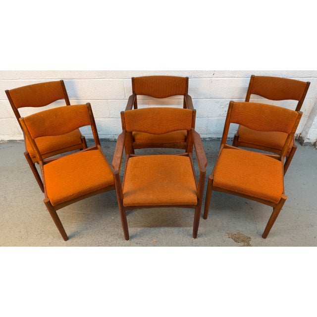 Set of six MCM vintage Danish teak dining chairs, including (2) armchairs and (4) side chairs, upholstered in a textured...