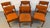 Set of six MCM vintage Danish teak dining chairs, including (2) armchairs and (4) side chairs, upholstered in a textured...