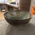 Refined centerpiece in porcelain stoneware, decorated in dark green and brown tones. Under the base, the manufacturer's...