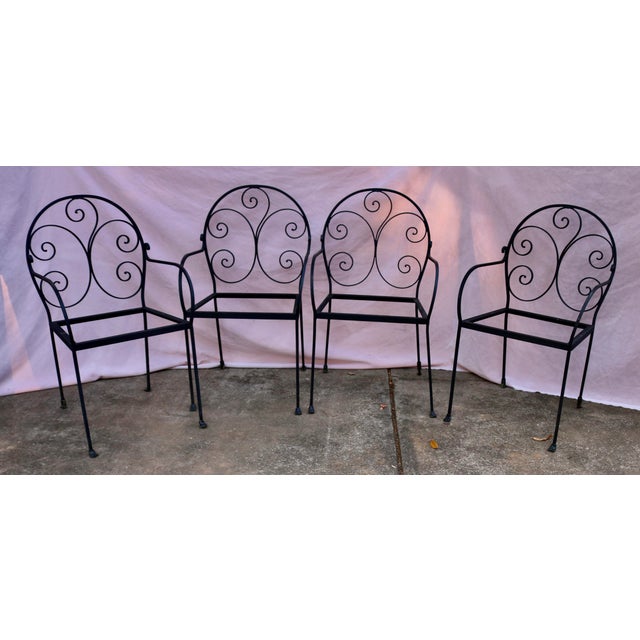 Vintage Patio or Garden Glass Top Table and 4 Chairs. The table is 41.5 inch in diameter and 30 inch high. The chairs are...