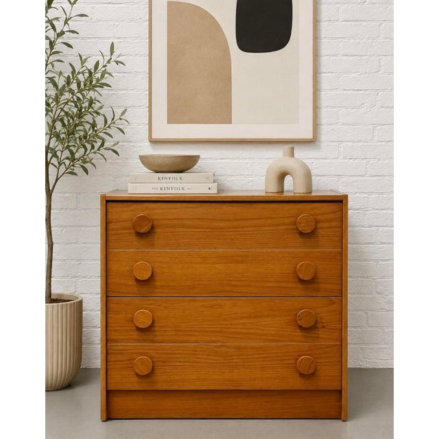 Mid Century Modern teak chest of drawers featuring rich old growth teak, clean architectural lines, and distinctive...