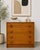 Mid Century Modern teak chest of drawers featuring rich old growth teak, clean architectural lines, and distinctive...