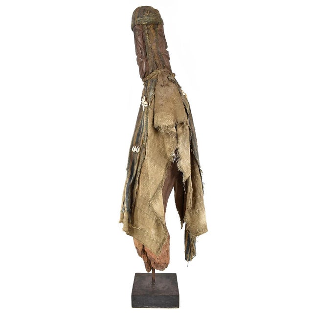 The Toma wood figure, hand-carved in West Africa, exemplifies the artistic skill of the Toma people. This sculpture,...
