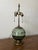 A beautifully proportioned petite 1930s Art Deco table lamp featuring a striking smoke blue-green art glass globe paired...