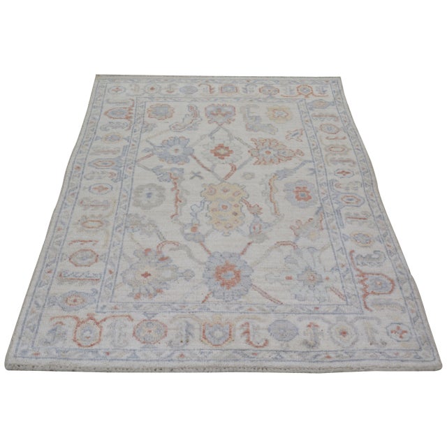 Turkish Oushak Hand-knotted with care using traditional rug-making techniques, this wool rug blends timeless craftsmanship...