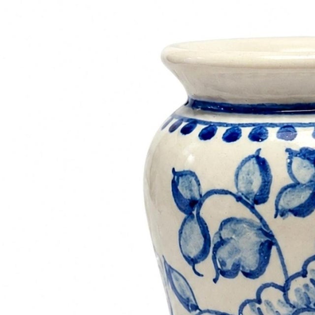 Earthenware - Lamego Widow earthenware sleeve. Portuguese, 20th century; blue and white decoration with floral motifs....