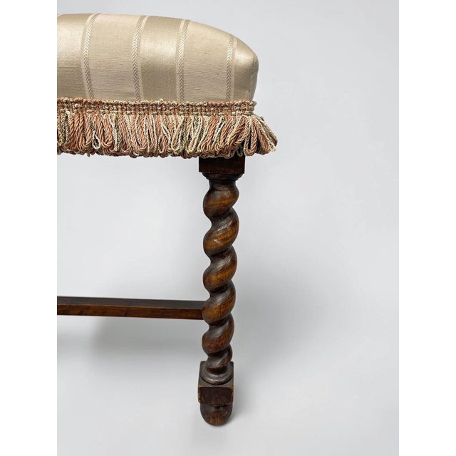 A beautifully preserved antique Jacobean Revival bench dating to approximately the turn of the twentieth century,...