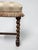 A beautifully preserved antique Jacobean Revival bench dating to approximately the turn of the twentieth century,...
