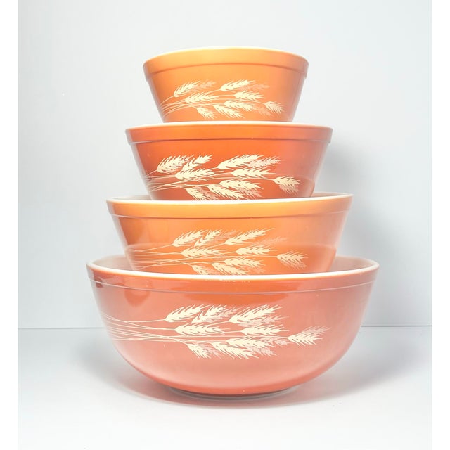 1970s Pyrex “Autumn Harvest (Wheat)” 4-Piece Orange Glass Mixing Bowl Set 401-04 Overall good vintage condition. No chips,...