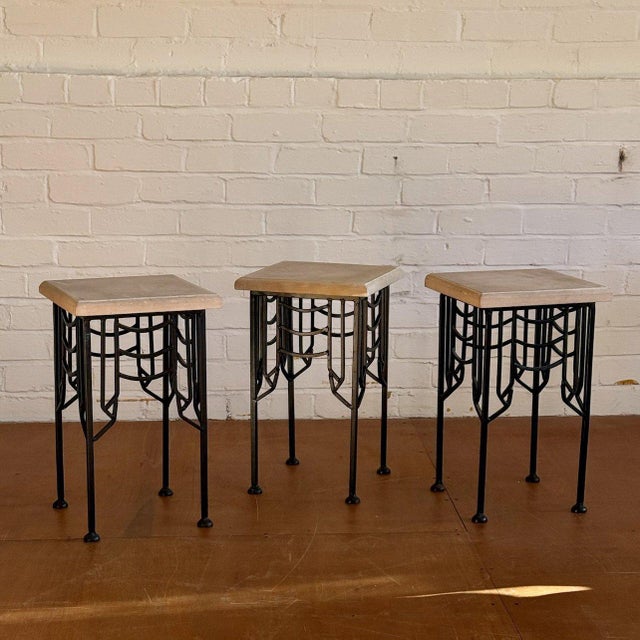Bespoke structural black wrought iron table featuring a contrasting sandstone surface. Condition Vintage condition, some...