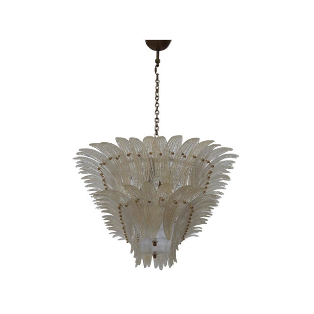 This elegant suspension lamp, handcrafted in italy, features a refined brass structure adorned with two tiers of clear...