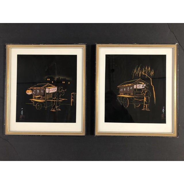 Mid-Century Black and Gold Japanese Rickshaw Scenic in their original artwork in gold frames. Both feature a rickshaw...