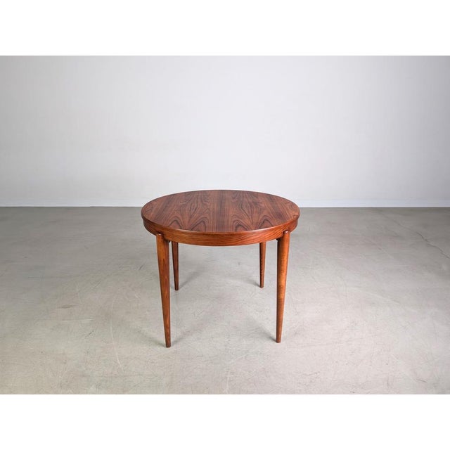 We are offering a beautiful teak dining table from the 1960s for sale. The table impresses with its minimalist and simple...