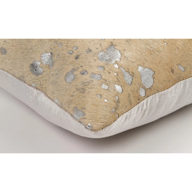Metalic Brazilian Cowhide, Silver Silky Velvet back, Fiber insert This pillow is made using unique cowhides, with no two...