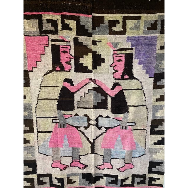 This monumental mid-20th century Peruvian textile features a powerful figural composition depicting two mirrored Inca...