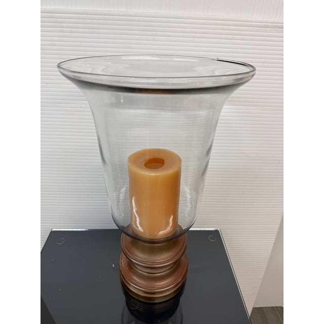 Design Plus Gallery presents a Hurricane Glass Candleholder from Sarreid, LTD. This type of light is great for outdoor...