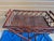 Vintage butler tray serving table that feature a dark stained finish and a distinctive woven rattan panels. Looks like...