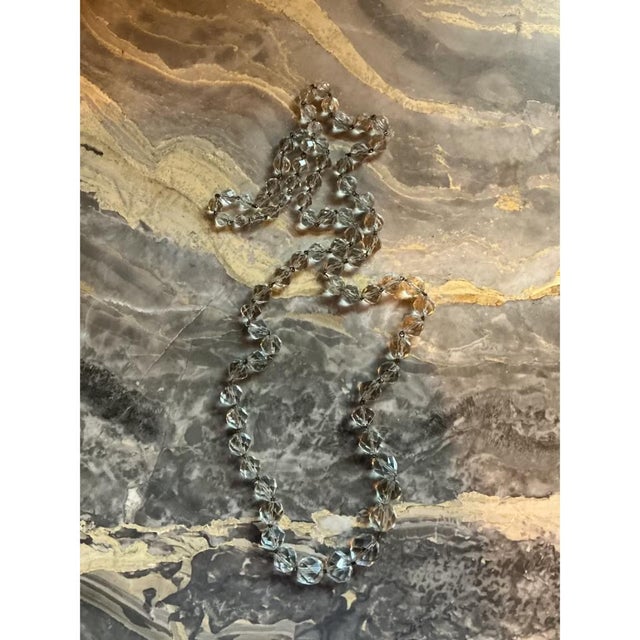 This vintage clear cut crystal necklace brings the crisp geometry of Mid-Century Modern design to a wearable accessory....