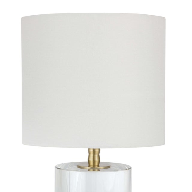 Stunning and elegant, the Juliet Table Lamp is crafted of optical crystal, fitted with natural brass hardware and topped...