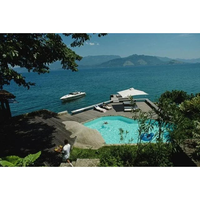 Pool By The Sea 1985 by Slim Aarons Slim Aarons Limited Estate Edition A swimming pool and lounge deck over the sea at...