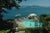 Pool By The Sea 1985 by Slim Aarons Slim Aarons Limited Estate Edition A swimming pool and lounge deck over the sea at...