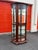 This Pulaski Furniture curio cabinet features a graceful bowed glass front with wraparound side panels, offering...