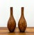A striking pair of Murano style hand-blown art glass vases featuring elegant bottleneck silhouettes in richly layered...