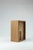 Music box in honey onyx and walnut wood transform the archetypal signs of dwelling into sound and material presence. The...