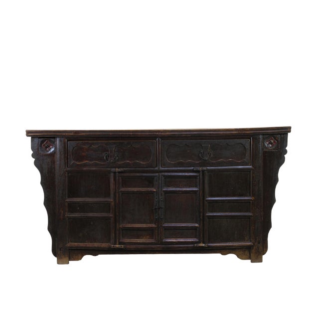This rare antique Chinese sideboard reflects more than 250 years of natural use and aging. Its once-black finish has...