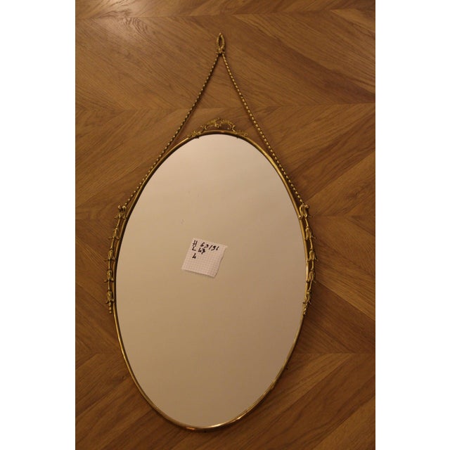 This highly decorative mirror was made in Italy in the 1950s. It is typical of the design of that period and is entirely...