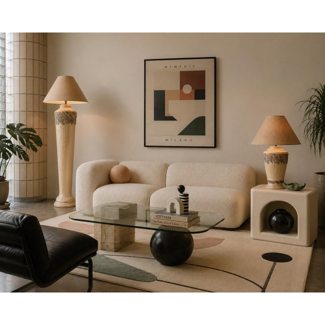 Bring a cohesive layer of sculptural Postmodern charm into your space with this stricking matched lighting set from the...